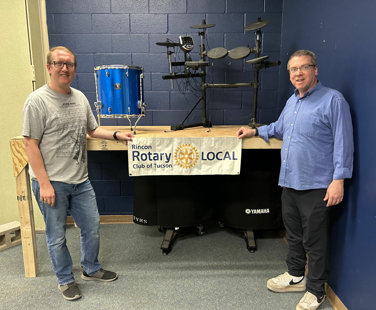Rincon Rotary bangs a drum, then puts it away at Rincon Vista Middle School.
